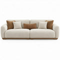 Crèmekleurige 3-zitsbank van bouclé 240 x 100 x 78 cm met walnootbruine plint